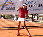 Ellen Perez returning serve during the girls singles final