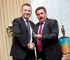 Mr. Oscar Yildiz (Mayor of Moreland City Council) receives gift from Mr. Naci Numanoglu (General Secretary of the Turkish School Federation)