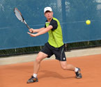 Mitchell Pritchard playing a forehand shot during the boys singles final