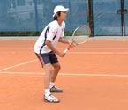 Yuya Ito at the net during the boys doubles final