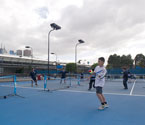Students participating in a range of tennis activities (Photo: Elizabeth Xue-Bai)